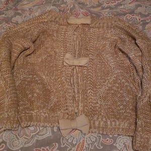 Open back sweater with bow detail